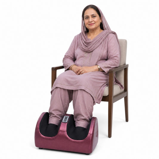 Woman using electric foot and leg massager machine