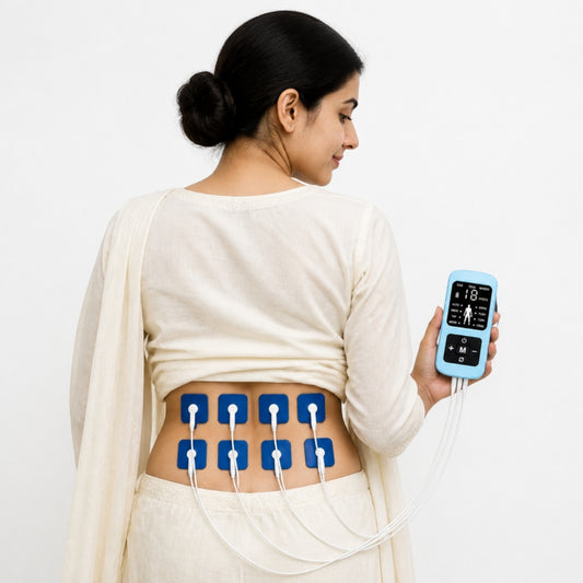 Woman using 8-pad TENS EMS device on lower back for period pain relief