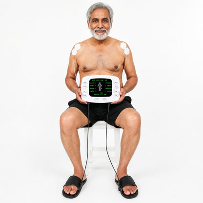 Elderly man using foot EMS TENS machine with electrode slippers and 4 pads